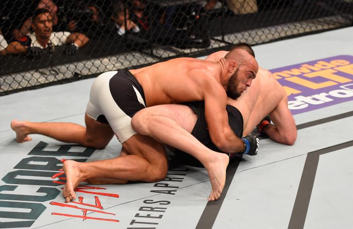 Ilir Latifi takes down Gian Villante in their light heavyweight bout during the UFC 196 event inside MGM Grand Garden Arena on March 5, 2016 in Las Vegas, Nevada.
