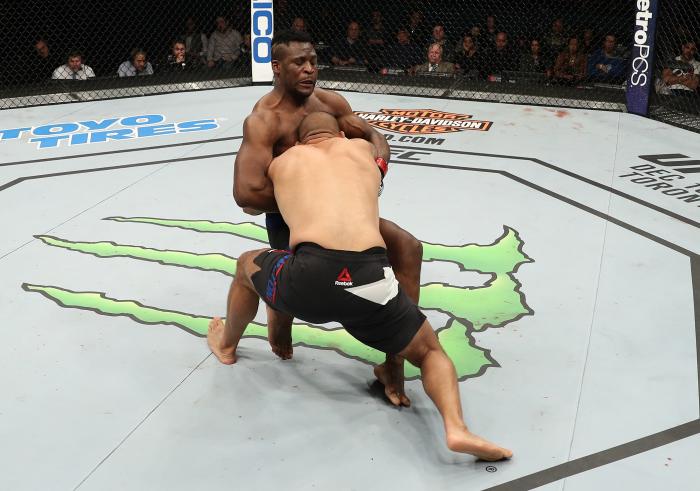 ALBANY, NY - DECEMBER 09: (R-L) Anthony Hamilton takes down Francis Ngannou of Cameroon in their heavyweight bout during the UFC Fight Night event at the Times Union Center on December 9, 2016 in Albany, New York. (Photo by Patrick Smith/Zuffa LLC via Getty Images)