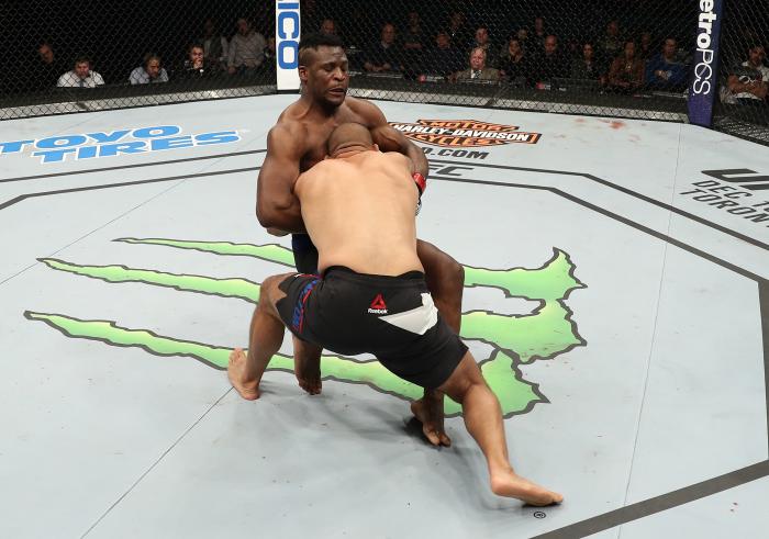 ALBANY, NY - DECEMBER 09:  (R-L) Anthony Hamilton takes down Francis Ngannou of Cameroon in their heavyweight bout during the UFC Fight Night event at the Times Union Center on December 9, 2016 in Albany, New York. (Photo by Patrick Smith/Zuffa LLC via Getty Images)