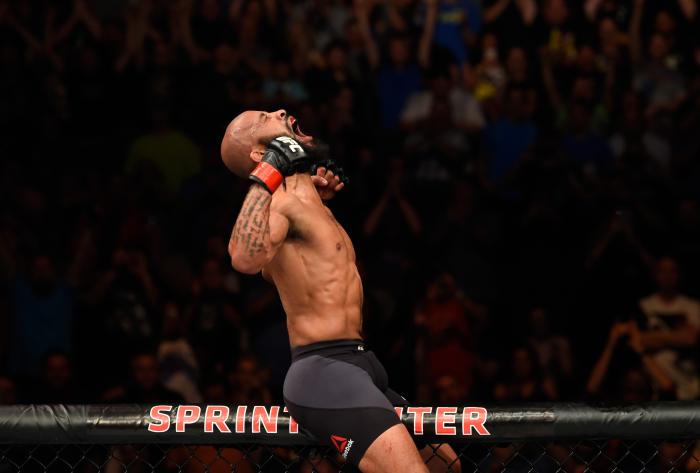 KANSAS CITY, MO - APRIL 15: Demetrious Johnson celebrates his submission victory over Wilson Reis of Brazil in their UFC flyweight fight during the UFC Fight Night event at Sprint Center on April 15, 2017 in Kansas City, Missouri. (Photo by Josh Hedges/Zuffa LLC/Zuffa LLC via Getty Images)