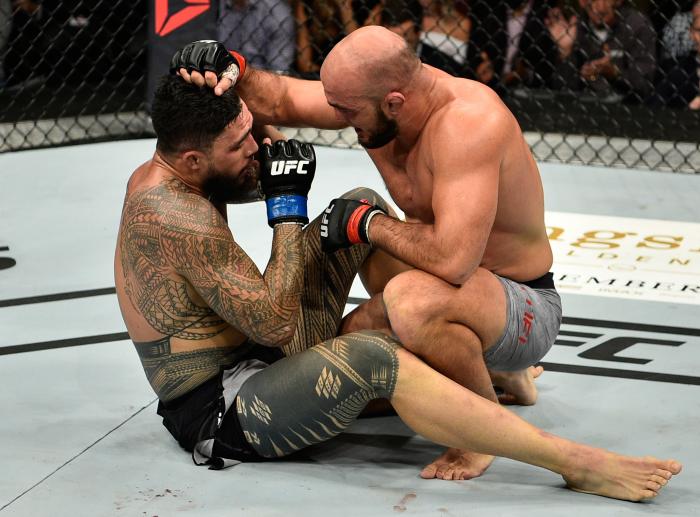 EDMONTON, AB - SEPTEMBER 09:  (R-L) Ilir Latifi of Sweden embraces Tyson Pedro of Australia after their light heavyweight bout during the UFC 215 event inside the Rogers Place on September 9, 2017 in Edmonton, Alberta, Canada. (Photo by Jeff Bottari/Zuffa LLC via Getty Images)