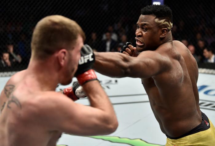 BOSTON, MA - JANUARY 20:  (R-L) Francis Ngannou of Cameroon punches Stipe Miocic in their heavyweight championship bout during the UFC 220 event at TD Garden on January 20, 2018 in Boston, Massachusetts. (Photo by Jeff Bottari/Zuffa LLC via Getty Images)