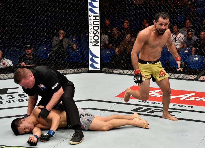 PERTH, AUSTRALIA - FEBRUARY 11:  (R-L) Jussier Formiga of Brazil celebrates his submission victory over Ben Nguyen in their flyweight bout during the UFC 221 event at Perth Arena on February 11, 2018 in Perth, Australia. (Photo by Jeff Bottari/Zuffa LLC via Getty Images)