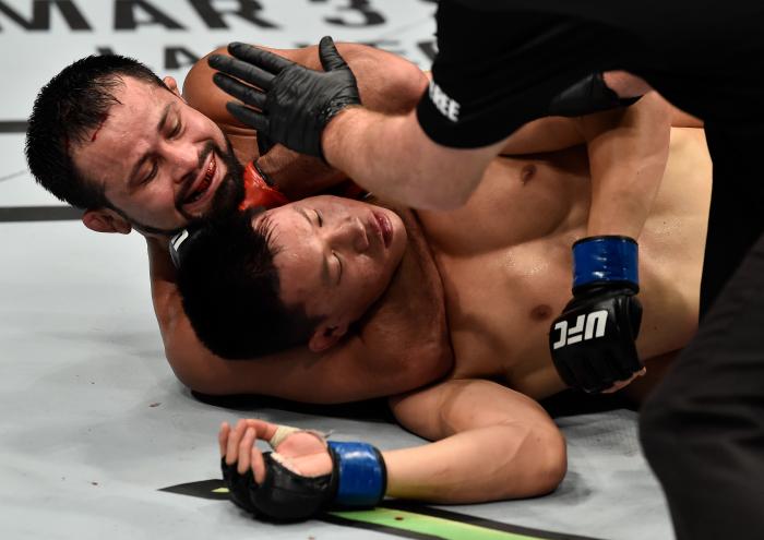 PERTH, AUSTRALIA - FEBRUARY 11: (L-R) Jussier Formiga of Brazil submits Ben Nguyen in their flyweight bout during the UFC 221 event at Perth Arena on February 11, 2018 in Perth, Australia. (Photo by Jeff Bottari/Zuffa LLC via Getty Images)
