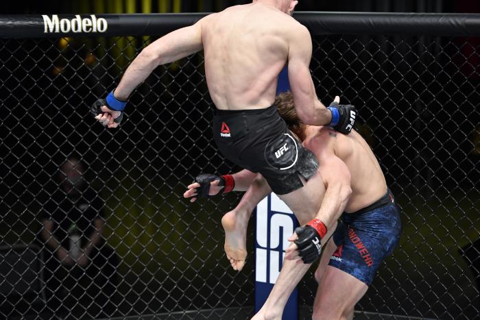 Julian Erosa lands a flying knee against Nate Landwehr in a featherweight bout during the UFC Fight Night event at UFC APEX on February 20, 2021 in Las Vegas, Nevada. (Photo by Chris Unger/Zuffa LLC)