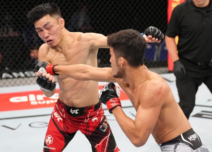 Kyung Ho Kang punches Batgerel Danaa at UFC 275