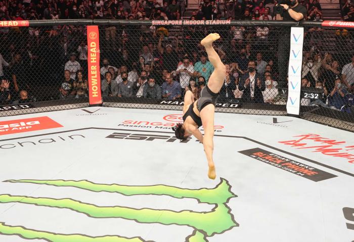 Zhang Weili celebrates after her knockout victory at UFC 275