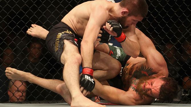 LAS VEGAS, NV - OCTOBER 06: Khabib Nurmagomedov of Russia (R) punches Conor McGregor of Ireland in their UFC lightweight championship bout during the UFC 229 event inside T-Mobile Arena on October 6, 2018 in Las Vegas, Nevada. (Photo by Christian Peters