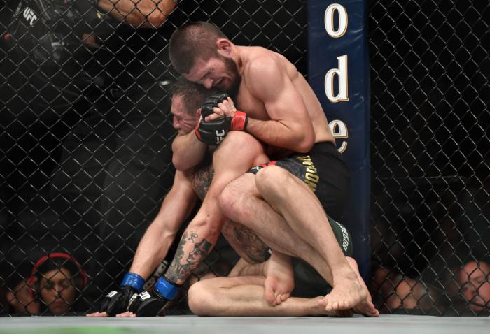 LAS VEGAS, NV - OCTOBER 06: (R-L) Khabib Nurmagomedov of Russia submits Conor McGregor of Ireland in their UFC lightweight championship bout during the UFC 229 event inside T-Mobile Arena on October 6, 2018 in Las Vegas, Nevada. (Photo by Brandon Magnus/