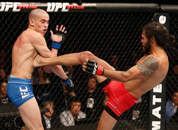 MEXICO CITY, MEXICO - NOVEMBER 15: (R-L) Marco Beltra kicks Marlon Vera in their bantamweight bout during the UFC 180 event at Arena Ciudad de Mexico on November 15, 2014 in Mexico City, Mexico. (Photo by Josh Hedges/Zuffa LLC/Zuffa LLC via Getty Images