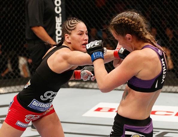 MEXICO CITY, MEXICO - NOVEMBER 15: (L-R) Jessica Eye punches Leslie Smith in their women's bantamweight bout during the UFC 180 event at Arena Ciudad de Mexico on November 15, 2014 in Mexico City, Mexico. (Photo by Josh Hedges/Zuffa LLC/Zuffa LLC via Ge