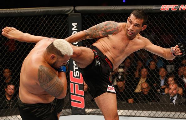 MEXICO CITY, MEXICO - NOVEMBER 15: (R-L) Fabricio Werdum kicks Mark Hunt in their interim UFC heavyweight championship bout during the UFC 180 event at Arena Ciudad de Mexico on November 15, 2014 in Mexico City, Mexico. (Photo by Josh Hedges/Zuffa LLC/Z