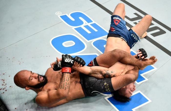 LAS VEGAS, NV - OCTOBER 07: Demetrious Johnson secures an arm bar submission against Ray Borg in their UFC flyweight championship bout during the UFC 216 event inside T-Mobile Arena on October 7, 2017 in Las Vegas, Nevada. (Photo by Jeff Bottari/Zuffa L