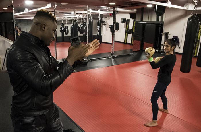 Las Vegas 12/27/17 - Cynthia Calvillo with Francis Ngannou practicing the KO upper during UFC 219 fight week. (Photo credit Juan Cardenas)