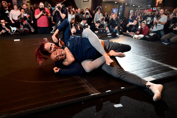 Cris Cyborg of Brazil (L) and special guest BJ Penn hold an open training session for fans and media during the UFC 222 Open Workouts at MGM Grand Hotel & Casino on March 1, 2018 in Las Vegas, Nevada. (Photo by Jeff Bottari/Zuffa LLC)