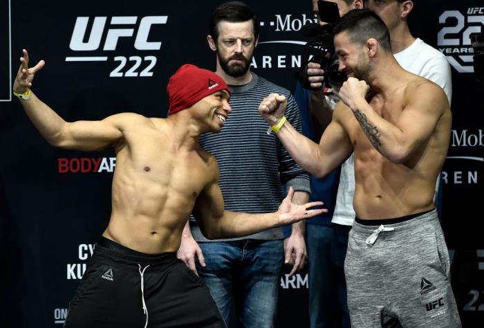 LAS VEGAS, NV - MARCH 02:   (L-R) John Dodson and Pedro Munhoz face off during a UFC 222 weigh-in on March 2, 2018 in Las Vegas, Nevada. (Photo by Jeff Bottari/Zuffa LLC)