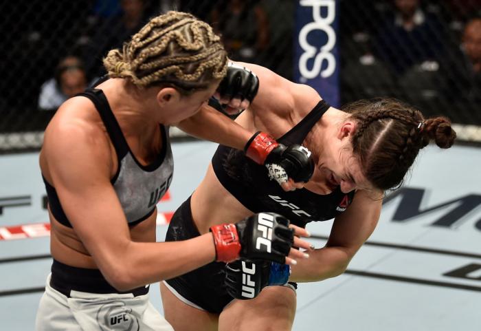 LAS VEGAS, NV - MARCH 03:   (L-R) Ashley Yoder punches Mackenzie Dern in their women's strawweight bout during the UFC 222 event inside T-Mobile Arena on March 3, 2018 in Las Vegas, Nevada. (Photo by Jeff Bottari/Zuffa LLC/Zuffa LLC via Getty Images)