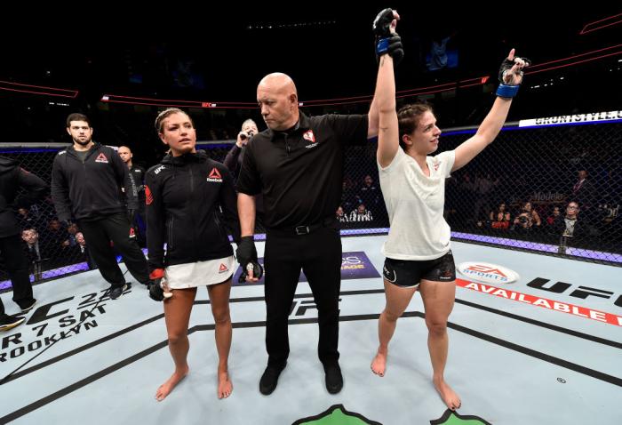 LAS VEGAS, NV - MARCH 03:   Mackenzie Dern celebrates after her split-decision victory over Ashley Yoder in their women's strawweight bout during the UFC 222 event inside T-Mobile Arena on March 3, 2018 in Las Vegas, Nevada. (Photo by Jeff Bottari/Zuffa L