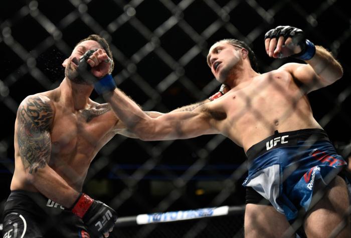 LAS VEGAS, NV - MARCH 03: (R-L) Brian Ortega knocks out Frankie Edgar in their featherweight bout during the UFC 222 event inside T-Mobile Arena on March 3, 2018 in Las Vegas, Nevada. (Photo by Brandon Magnus/Zuffa LLC/Zuffa LLC via Getty Images)
