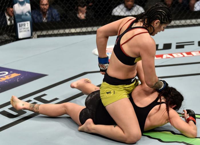 LAS VEGAS, NV - MARCH 03:   (L-R) Ketlen Vieira of Brazil punches Cat Zingano in their women's bantamweight bout during the UFC 222 event inside T-Mobile Arena on March 3, 2018 in Las Vegas, Nevada. (Photo by Jeff Bottari/Zuffa LLC/Zuffa LLC via Getty Ima