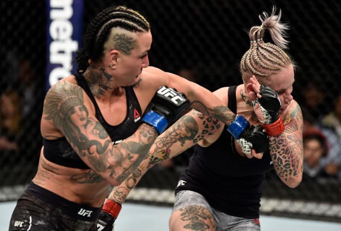 BROOKLYN, NEW YORK - APRIL 07:  (L-R) Ashlee Evans-Smith punches Bec Rawlings of Australia in their women's flyweight bout during the UFC 223 event inside Barclays Center on April 7, 2018 in Brooklyn, New York. (Photo by Jeff Bottari/Zuffa LLC/Zuffa LLC v