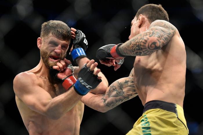 BROOKLYN, NEW YORK - APRIL 07:  (R-L) Renato Moicano of Brazil punches Calvin Kattar in their featherweight bout during the UFC 223 event inside Barclays Center on April 7, 2018 in Brooklyn, New York. (Photo by Brandon Magnus/Zuffa LLC/Zuffa LLC via Getty