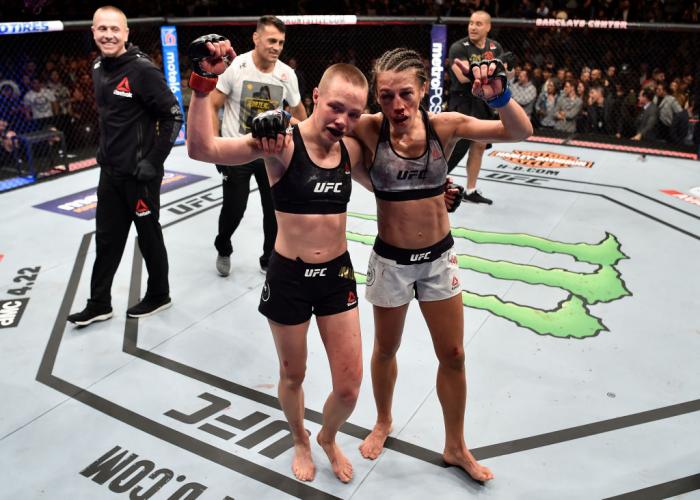 BROOKLYN, NEW YORK - APRIL 07:  (L-R) Opponents Rose Namajunas and Joanna Jedrzejczyk of Poland embrace after the conclusion of their women's strawweight title bout during the UFC 223 event inside Barclays Center on April 7, 2018 in Brooklyn, New York. (P