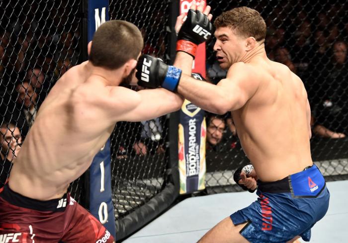 BROOKLYN, NEW YORK - APRIL 07:  (R-L) Al Iaquinta punches Khabib Nurmagomedov of Russia in their lightweight title bout during the UFC 223 event inside Barclays Center on April 7, 2018 in Brooklyn, New York. (Photo by Jeff Bottari/Zuffa LLC/Zuffa LLC via 