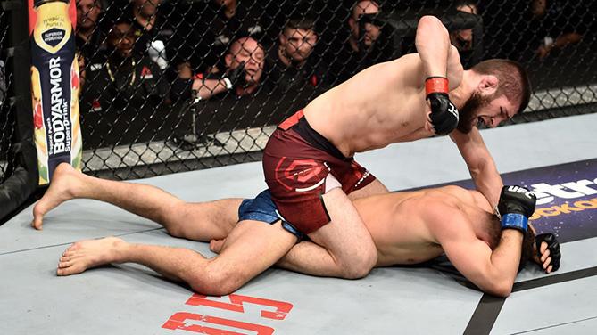 BROOKLYN, NEW YORK - APRIL 07: (L-R) Khabib Nurmagomedov of Russia punches Al Iaquinta in their lightweight title bout during the UFC 223 event inside Barclays Center on April 7, 2018 in Brooklyn, New York. (Photo by Jeff Bottari/Zuffa LLC/Zuffa LLC via