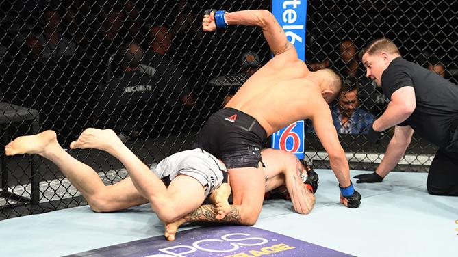 CHICAGO, ILLINOIS - JUNE 09: (R-L) Dan Ige punches Mike Santiago in their featherweight fight during the UFC 225 event at the United Center on June 9, 2018 in Chicago, Illinois. (Photo by Josh Hedges/Zuffa LLC/Zuffa LLC via Getty Images)