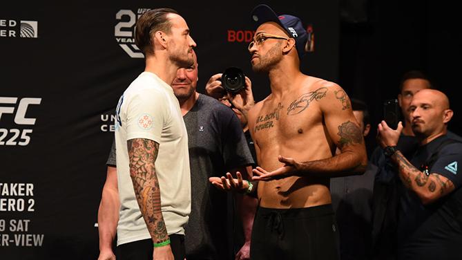 CHICAGO, ILLINOIS - JUNE 08:  (L-R) Opponents CM Punk and Mike Jackson face off during the UFC 225 weigh-in at the United Center on June 8, 2018 in Chicago, Illinois. (Photo by Josh Hedges/Zuffa LLC/Zuffa LLC via Getty Images)