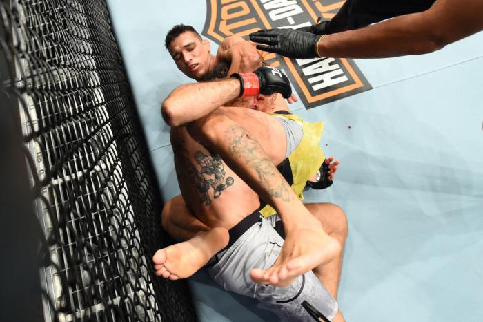 CHICAGO, ILLINOIS - JUNE 09:  (R-L) Charles Oliveira of Brazil submits Clay Guida in their lightweight fight during the UFC 225 event at the United Center on June 9, 2018 in Chicago, Illinois. This submission ties the all-time UFC record held by Royce Gra