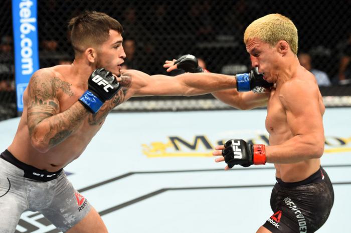 CHICAGO, ILLINOIS - JUNE 09: (L-R) Sergio Pettis punches Joseph Benavidez in their flyweight fight during the UFC 225 event at the United Center on June 9, 2018 in Chicago, Illinois. (Photo by Josh Hedges/Zuffa LLC/Zuffa LLC via Getty Images)