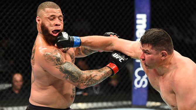 CHICAGO, ILLINOIS - JUNE 09:  (R-L) Chris De La Rocha punches Rashad Coulter in their heavyweight fight during the UFC 225 event at the United Center on June 9, 2018 in Chicago, Illinois. (Photo by Josh Hedges/Zuffa LLC/Zuffa LLC via Getty Images)