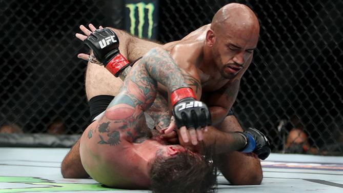 CHICAGO, IL - JUNE 09: Mike Jackson (top) lands an elbow on CM Punk (bottom) in the second round in their welterweight bout during the UFC 225: Whittaker v Romero 2 event at the United Center on June 9, 2018 in Chicago, Illinois. Jackson won by unanimous