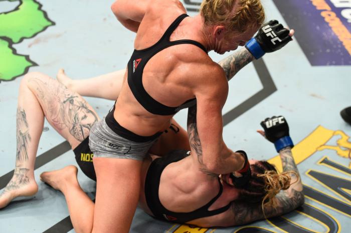 CHICAGO, ILLINOIS - JUNE 09:  (R-L) Holly Holm punches Megan Anderson of Australia in their women's featherweight fight during the UFC 225 event at the United Center on June 9, 2018 in Chicago, Illinois. (Photo by Josh Hedges/Zuffa LLC/Zuffa LLC via Getty