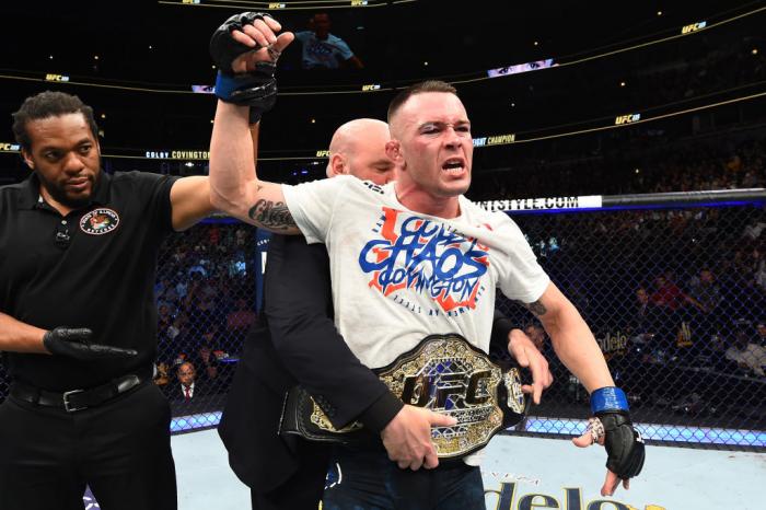 CHICAGO, ILLINOIS - JUNE 09: UFC President Dana White places the interim welterweight championship belt on Colby Covington after defeating Rafael Dos Anjos of Brazil in their interim welterweight title fight during the UFC 225 event at the United Center