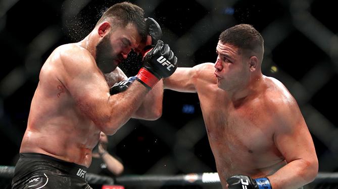 CHICAGO, IL - JUNE 09: Tai Tuivasa of Australia (R) lands a punch against Andrei Arlovski of Belarus (L) in the third round in their heavyweight bout during the UFC 225: Whittaker v Romero 2 event at the United Center on June 9, 2018 in Chicago, Illinois