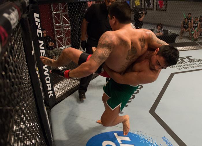 LAS VEGAS, NV - MARCH 27: (R-L) Erick Montano takes down Marco Olano during the filming of The Ultimate Fighter Latin America: Team Gastelum vs Team Escudero on March 27, 2015 in Las Vegas, Nevada. (Photo by Brandon Magnus/Zuffa LLC/Zuffa LLC via Getty