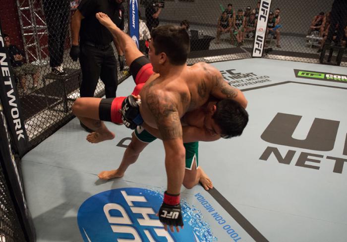 LAS VEGAS, NV - MARCH 27: (R-L) Erick Montano takes down Marco Olano during the filming of The Ultimate Fighter Latin America: Team Gastelum vs Team Escudero on March 27, 2015 in Las Vegas, Nevada. (Photo by Brandon Magnus/Zuffa LLC/Zuffa LLC via Getty