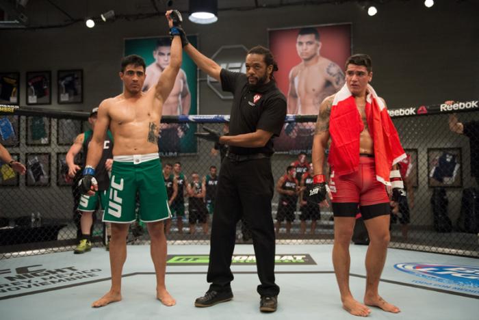 LAS VEGAS, NV - MARCH 27: (L-R) Erick Montano celebrates his victory over Marco Olano during the filming of The Ultimate Fighter Latin America: Team Gastelum vs Team Escudero on March 27, 2015 in Las Vegas, Nevada. (Photo by Brandon Magnus/Zuffa LLC/Zuf