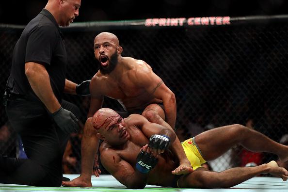 KANSAS CITY, MO - APRIL 15: Demetrious Johnson celebrates as he defeats Wilson Reis to win their Flyweight Championship bout on UFC Fight Night at the Sprint Center on April 15, 2017 in Kansas City, Missouri. (Photo by Jamie Squire/Getty Images)