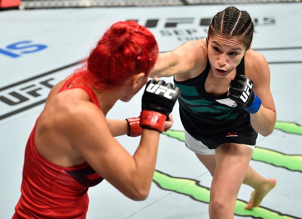 MEXICO CITY, MEXICO - AUGUST 05: (R-L) Alexa Grasso of Mexico punches Randa Markos of Iraq in their women's strawweight bout during the UFC Fight Night event at Arena Ciudad de Mexico on August 5, 2017 in Mexico City, Mexico. (Photo by Jeff Bottari/Zuffa