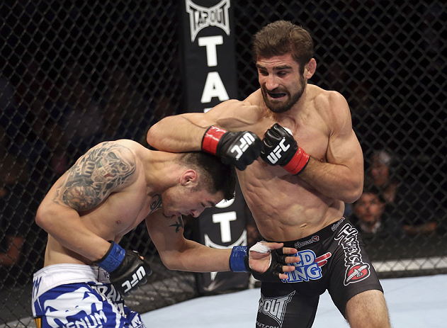 CALGARY, CANADA - JULY 21: (R-L) Antonio Carvalho exchanges punches with Daniel Pineda during their featherweight bout at UFC 149 inside the Scotiabank Saddledome on July 21, 2012 in Calgary, Alberta, Canada. (Photo by Nick Laham/Zuffa LLC/Zuffa LLC via