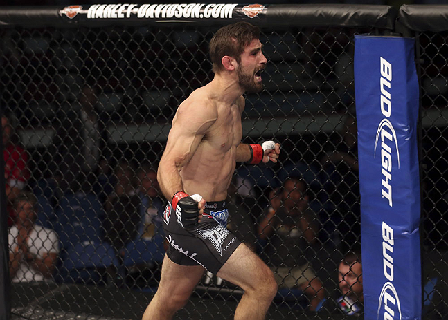 CALGARY, CANADA - JULY 21:  Antonio Carvalho celebrates after knocking out Daniel Pineda during their featherweight bout at UFC 149 inside the Scotiabank Saddledome on July 21, 2012 in Calgary, Alberta, Canada.  (Photo by Nick Laham/Zuffa LLC/Zuffa LLC vi