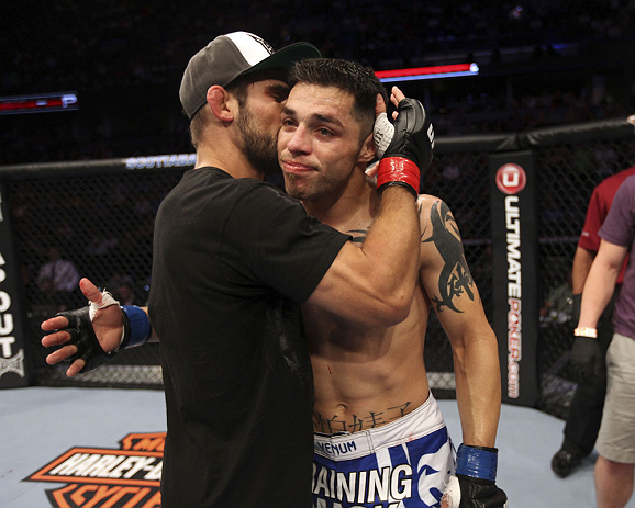 CALGARY, CANADA - JULY 21: (L-R) Antonio Carvalho hugs Daniel Pineda after Pineda was defeated by knockout in the first round during their featherweight bout at UFC 149 inside the Scotiabank Saddledome on July 21, 2012 in Calgary, Alberta, Canada. (Photo
