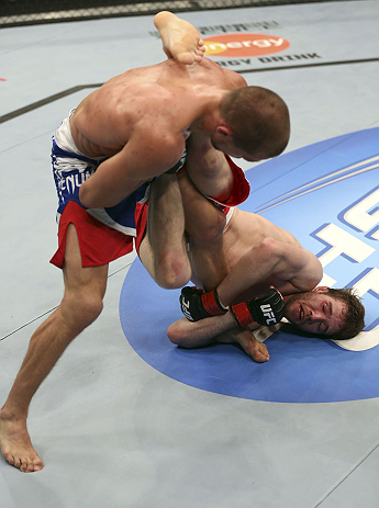CALGARY, CANADA - JULY 21: (R-L) Mitch Clarke wraps around the leg of Anton Kuivanen during their lightweight bout at UFC 149 inside the Scotiabank Saddledome on July 21, 2012 in Calgary, Alberta, Canada. (Photo by Nick Laham/Zuffa LLC/Zuffa LLC via Gett