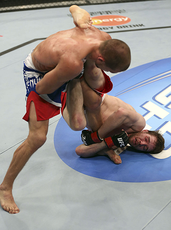 CALGARY, CANADA - JULY 21: (R-L) Mitch Clarke wraps around the leg of Anton Kuivanen during their lightweight bout at UFC 149 inside the Scotiabank Saddledome on July 21, 2012 in Calgary, Alberta, Canada.  (Photo by Nick Laham/Zuffa LLC/Zuffa LLC via Gett