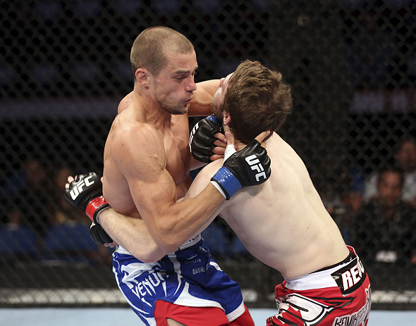 CALGARY, CANADA - JULY 21: (L-R) Anton Kuivanen attacks Mitch Clarke during their lightweight bout at UFC 149 inside the Scotiabank Saddledome on July 21, 2012 in Calgary, Alberta, Canada. (Photo by Nick Laham/Zuffa LLC/Zuffa LLC via Getty Images)