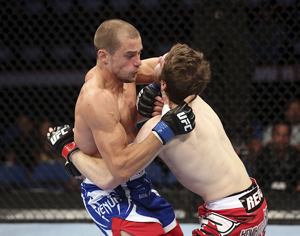 CALGARY, CANADA - JULY 21: (L-R) Anton Kuivanen attacks Mitch Clarke during their lightweight bout at UFC 149 inside the Scotiabank Saddledome on July 21, 2012 in Calgary, Alberta, Canada.  (Photo by Nick Laham/Zuffa LLC/Zuffa LLC via Getty Images)